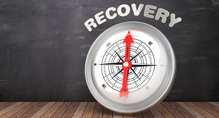 A compass pointing north at the word 'Recovery.'
