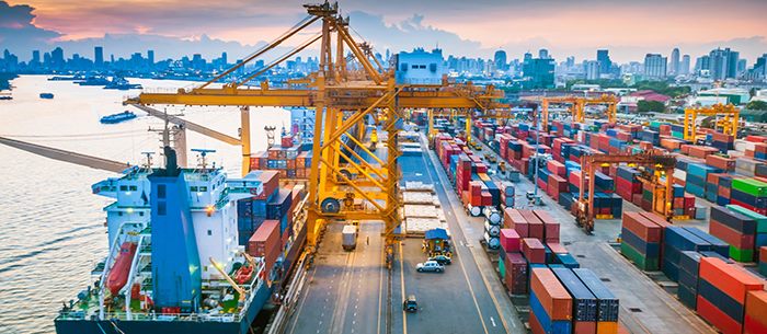 Busy port moving shipping containers.